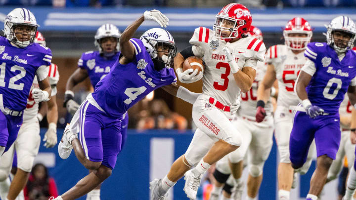 Crown Point High School junior Larry Ellison (3) runs deep into the Ben Davis High School secondary while being pursued by junior Mark Zackery, IV (4) during the first half of an IHSAA Class 6A State Championship football game, Saturday, Nov. 25, 2023, at Lucas Oil Stadium, in Indianapolis.