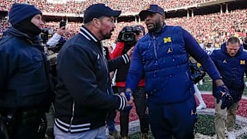 Ohio State Buckeyes head coach Ryan Day shakes hands with Michigan Wolverines head coach Sherrone Moore