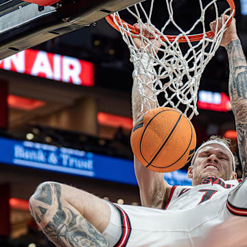 Louisville forward Kasean Pryor (7) slammed home two points during first half action as the Cardinals host Jackson State at the KFC Yum! Center on Tuesday, Nov. 6, 2025.