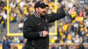 Nov 25, 2023; Ann Arbor, Michigan, USA; Ohio State Buckeyes head coach Ryan Day leads his team in warm-ups prior to the NCAA football game against the Michigan Wolverines at Michigan Stadium.