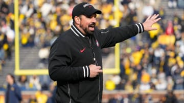 Nov 25, 2023; Ann Arbor, Michigan, USA; Ohio State Buckeyes head coach Ryan Day leads his team in warm-ups prior to the NCAA football game against the Michigan Wolverines at Michigan Stadium.