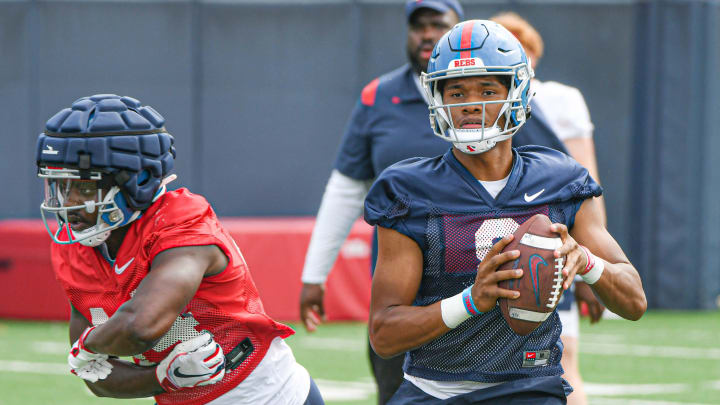 Quarterback Austin Simmons (8) throws a pass at Ole Miss football practice in Oxford, Miss., on Friday, Aug. 11, 2023.