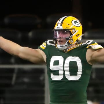 The Green Bay Packers' Lukas Van Ness (90) reacts against the Dallas Cowboys during the fourth quarter of their wild card playoff game Sunday, January 14, in Arlington, Texas. 