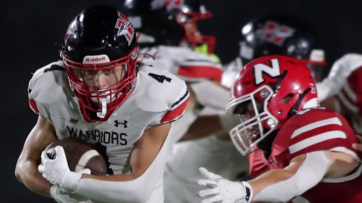 Muskego High School running back Dayton Lorino (4) sprints upfield during a non-conference season-opener against Neenah on Friday, August 22, 2025. Wm. Glasheen USA TODAY NETWORK-Wisconsin