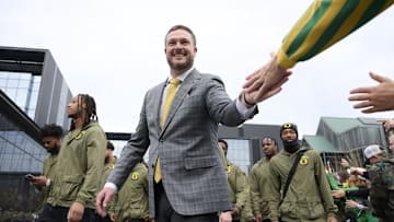 Nov 9, 2024; Eugene, Oregon, USA; Oregon Ducks head coach Dan Lanning high-fives fans before a game against the Maryland Terrapins at Autzen Stadium.