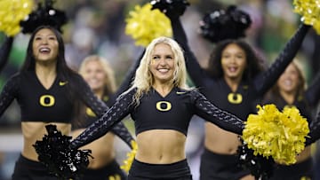Nov 30, 2024; Eugene, Oregon, USA; The Oregon Ducks cheer team perform during a time out during the second half of a game against the Washington Huskies at Autzen Stadium. Mandatory Credit: Troy Wayrynen-Imagn Images