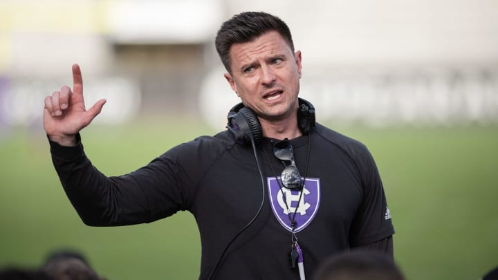 Holy Cross football coach Bob Chesney talks to the team after Saturday's spring game.

HC 20