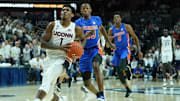 Nov 17, 2019; Storrs, CT, USA; Connecticut Huskies guard Christian Vital (1) prepares to shoot the ball past Florida Gators guard Scottie Lewis (23) in the first half at Harry A. Gampel Pavilion. Mandatory Credit: David Butler II-Imagn Images