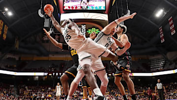 Michigan State forward Coen Carr (55) and forward Jaxon Kohler (0) jump for the ball during the second half against Minnesota at Williams Arena in Minneapolis on Dec. 4, 2024.