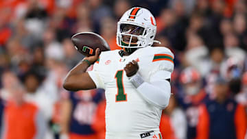 Nov 30, 2024; Syracuse, New York, USA; Miami Hurricanes quarterback Cam Ward (1) passes the ball against the Syracuse Orange during the first half at the JMA Wireless Dome. Mandatory Credit: Rich Barnes-Imagn Images
