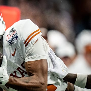 Texas Longhorns wide receiver Matthew Golden (2) catches a long pass for a first down near the end zone in the fourth quarter as the Texas Longhorns play the Arizona State Sun Devils in the Peach Bowl College Football Playoff quarterfinal at Mercedes-Benz Stadium in Atlanta, Georgia, Jan. 1, 2025.