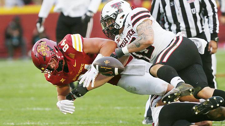 Texas Tech Red Raiders' linebacker Jacob Rodriguez (10) knocks out the ball ball from Iowa State Cyclones tight end Gabe Burkle (82) and created a fumble during the third quarter in the week-10 NCAA football at Jack Trice Stadium on Saturday, Nov. 2, 2024, in Ames, Iowa.