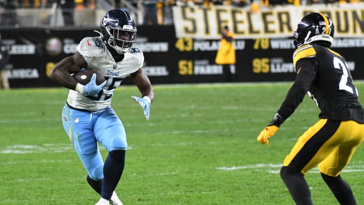 Nov 2, 2023; Pittsburgh, Pennsylvania, USA; Tennessee Titans tight end Chig Okonkwo (85) gains five yards as Pittsburgh Steelers cornerback Darius Rush (21) provides coverage during the fourthquarter at Acrisure Stadium. The Steelers won 20-16. Mandatory Credit: Philip G. Pavely-USA TODAY Sports
