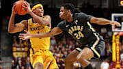 Minnesota Golden Gophers guard Isaac Asuma (1) works around Purdue Boilermakers guard Gicarri Harris (24)