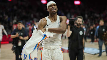 Jan 26, 2025; Portland, Oregon, USA; Oklahoma City Thunder guard Shai Gilgeous-Alexander (2) gives his shirt away to a fan after a game against the Portland Trail Blazers at Moda Center. Mandatory Credit: Troy Wayrynen-Imagn Images