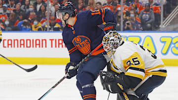 Dec 1, 2021; Edmonton, Alberta, CAN; Edmonton Oilers forward Zach Hyman (18) tries to screen Pittsburgh Penguins goaltender Tristan Jarry (35) during the first period at Rogers Place. Mandatory Credit: Perry Nelson-Imagn Images