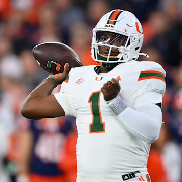 Nov 30, 2024; Syracuse, New York, USA; Miami Hurricanes quarterback Cam Ward (1) passes the ball against the Syracuse Orange during the first half at the JMA Wireless Dome. Mandatory Credit: Rich Barnes-Imagn Images