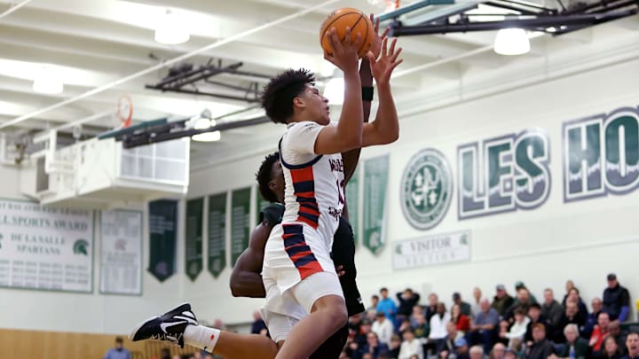 Guard of Modesto Christian soars to the basket against St. Joseph in the 27th MLK Classic at De La Salle High School. Guard of Modesto Christian soars to the basket against St. Joseph in the 27th MLK Classic at De La Salle High School.
