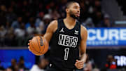 Nets forward Mikal Bridges dribbles the basketball during a game against the Detroit Pistons at Little Caesars Arena. 