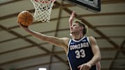 Gonzaga Bulldogs forward Ben Gregg (33) scores a basket during the second half against the Portland Pilots. 