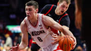 Nov 24, 2025; Tucson, Arizona, USA; Arizona Wildcats forward Ivan Kharchenkov (8) dribbles the ball during the second half of the game against the Denver Pioneers at McKale Memorial Center. Mandatory Credit: Aryanna Frank-Imagn Images