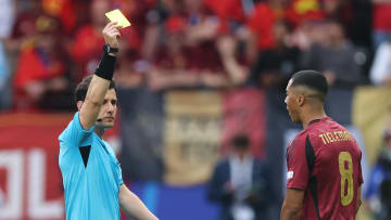 Youri Tielemans receives a yellow card in Belgium's defeat to Slovakia