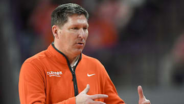 Feb 26, 2025; Clemson, South Carolina, USA; Clemson Head Coach Brad Brownell reacts with the team in the game against Notre Dame during the second half at Littlejohn Coliseum. Mandatory Credit: Ken Ruinard-Imagn Images