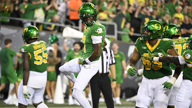 Oregon Ducks wide receiver Evan Stewart (7) celebrates after scoring a touchdown 