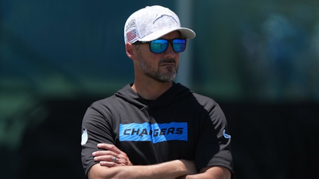 Jessee Minter with his arms croosed