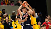 Arizona Wildcats forward Henri Veesaar (13) is pressured by Baylor Bears guard Jeremy Roach (3) and guard VJ Edgecombe (7) during the first half at Paul and Alejandra Foster Pavilion.