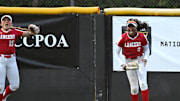 Orange Lutheran's Kai Minor (right) celebrates after robbing a home run in the CIF Southern Section Division 1 final in 2024 against Pacifica/Garden Grove.