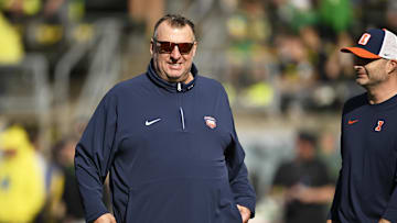 Oct 26, 2024; Eugene, Oregon, USA; Illinois Fighting Illini head coach Bret Bielema watches players warm up before a game against the Oregon Ducks at Autzen Stadium. Mandatory Credit: Troy Wayrynen-Imagn Images