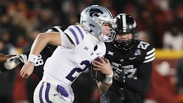 Kansas State Wildcats quarterback Avery Johnson (2) runs with the ball around Iowa State Cyclones linebacker Will McLaughlin (23) during the first quarter in the NCAA football at Jack Trice Stadium on Saturday, Nov. 30, 2024, in Ames, Iowa.
