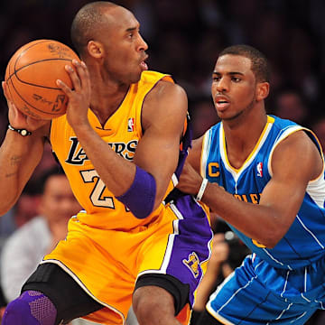 April 20, 2011; Los Angeles, CA, USA; Los Angeles Lakers shooting guard Kobe Bryant (24) moves the ball against the defense of New Orleans Hornets point guard Chris Paul (3) in the first half of game two of the first round of the 2011 NBA playoffs at the Staples Center. 