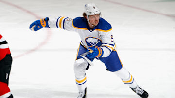 Jack Eichel (9) in a game against the Devils. 
