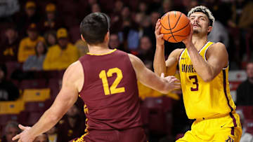 Minnesota Golden Gophers forward Dawson Garcia (3) shoots as Bethune-Cookman Wildcats forward Jesus Carralero Martin (12) defends during the first half at Williams Arena.