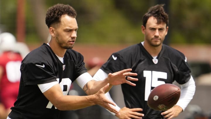 Arizona Cardinals quarterbacks Desmond Ridder (19) and Clayton Tune (15) during organized team activities in Tempe on May 20, 2024.