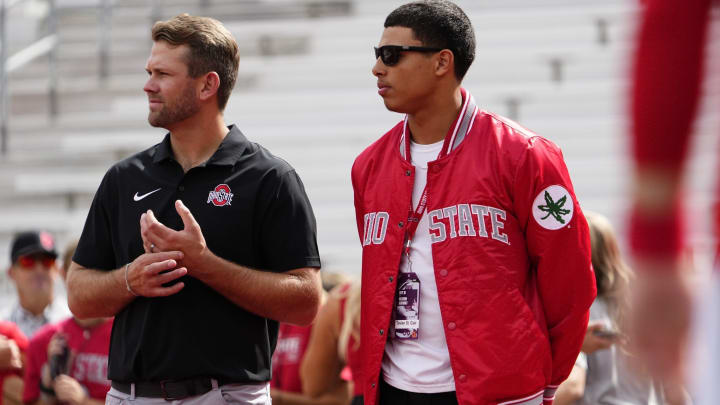 Sep 16, 2023; Columbus, Ohio, USA; Ohio State Buckeyes quarterbacks coach Corey Dennis stands with recruit Tavien St. Clair of Bellefontaine during the NCAA football game at Ohio Stadium.