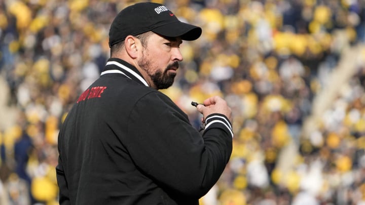 Nov 25, 2023; Ann Arbor, Michigan, USA; Ohio State Buckeyes head coach Ryan Day leads his team in warm-ups prior to the NCAA football game against the Michigan Wolverines at Michigan Stadium.