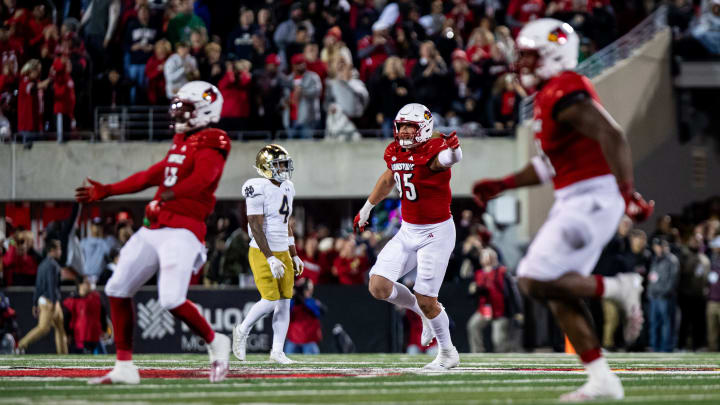 Louisville defensive players celebrated while running off the field as the Louisville Cardinals defeated the Notre Dame Fighting Irish, 33-20 on Saturday, Oct. 7, 2023