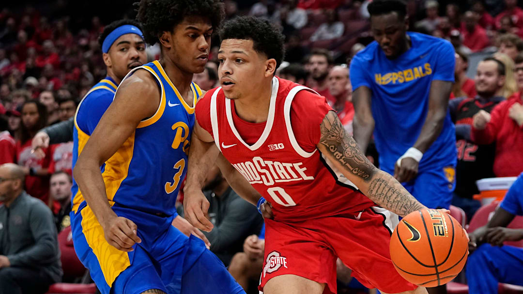 Ohio State Buckeyes guard John Mobley Jr. (0) dribbles around Pittsburgh Panthers guard Brandin Cummings (3) during the first half of the NCAA men's basketball game at Value City Arena in Columbus on Friday, Nov. 29, 2024.