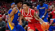 Ohio State Buckeyes guard John Mobley Jr. (0) dribbles around Pittsburgh Panthers guard Brandin Cummings (3) during the first half of the NCAA men's basketball game at Value City Arena in Columbus on Friday, Nov. 29, 2024.