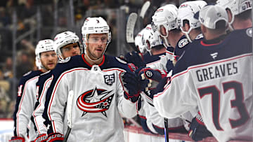 Blue Jackets center Charlie Coyle celebrates a goal with his bench. 