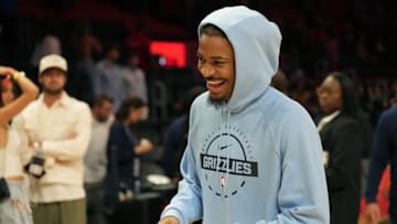 Oct 17, 2025; Miami, Florida, USA;  Memphis Grizzlies guard Ja Morant (12) who did not play due to injury, leaves the court after the Memphis Grizzlies defeat the Miami Heat at Kaseya Center. Mandatory Credit: Jim Rassol-Imagn Images
