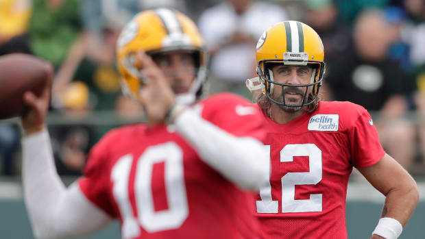 Green Bay Packers quarterback Jordan Love (10) and quarterback Aaron Rodgers (12) participate in training camp practice.