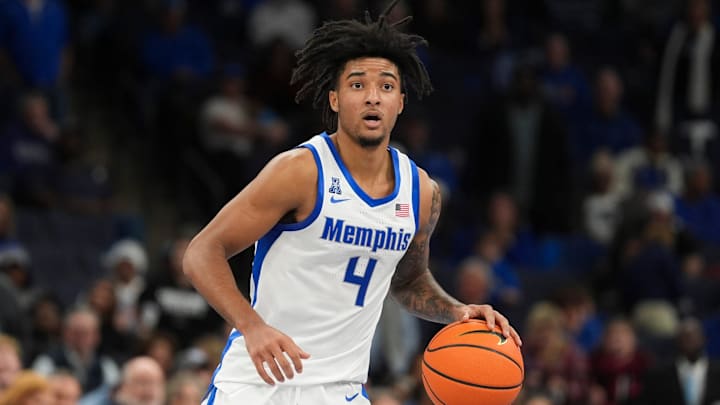 Memphis' PJ Haggerty (4) dribbles down the court during the game between Arkansas State University and the University of Memphis at FedExForum in Memphis, Tenn., on Sunday, December 8, 2024.