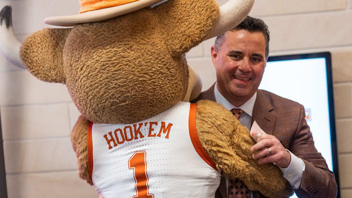 Sean Miller hugs Hook 'Em as he is announced The University of Texas' new men's basketball coach Tuesday, March 25, 2025.