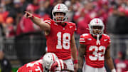 Ohio State Buckeyes quarterback Will Howard (18) signals to his offense during the second half of the NCAA football game against the Indiana Hoosiers at Ohio Stadium in Columbus on Saturday, Nov. 23, 2024. Ohio State won 38-15.
