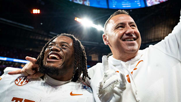 Texas Longhorns running back Jaydon Blue (23) and head coach Steve Sarkisian celebrate the Longhorns 39-31 double overtime wi