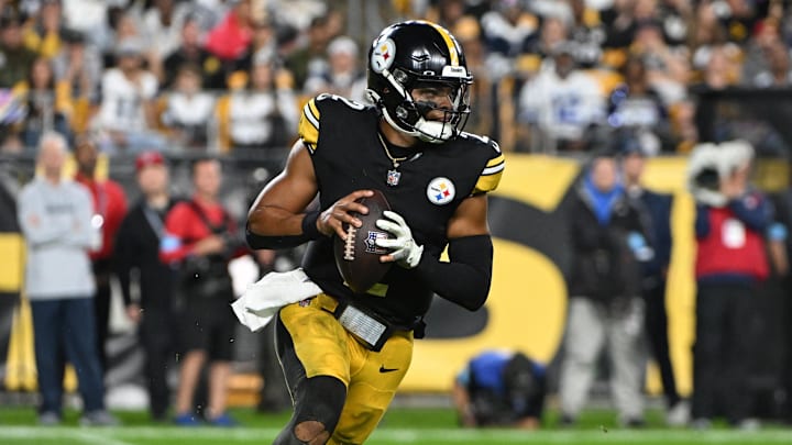 Oct 6, 2024; Pittsburgh, Pennsylvania, USA; Pittsburgh Steelers quarterback Justin Fields (2) scrambles against the Dallas Cowboys during the first quarter at Acrisure Stadium. Mandatory Credit: Barry Reeger-Imagn Images





